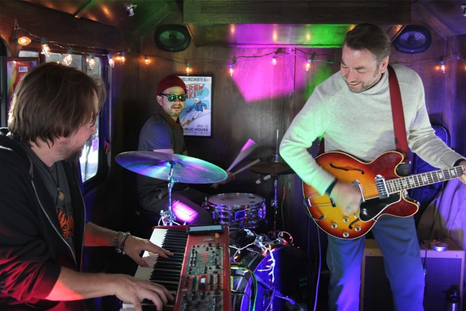 A live band performing music at a bar.